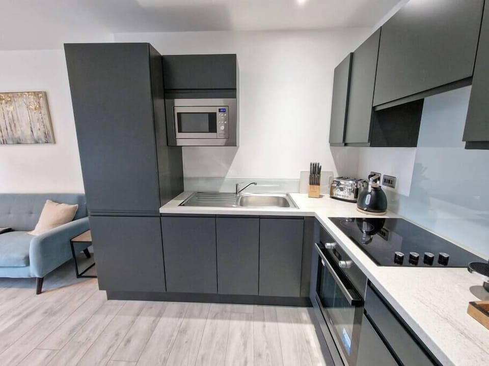 A fully equipped kitchen flows into the dining space, making mealtimes effortless