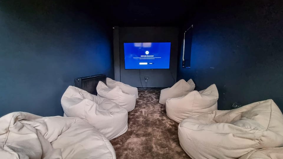 Private cinema room with plush seating, grab the popcorn and settle in for movie night