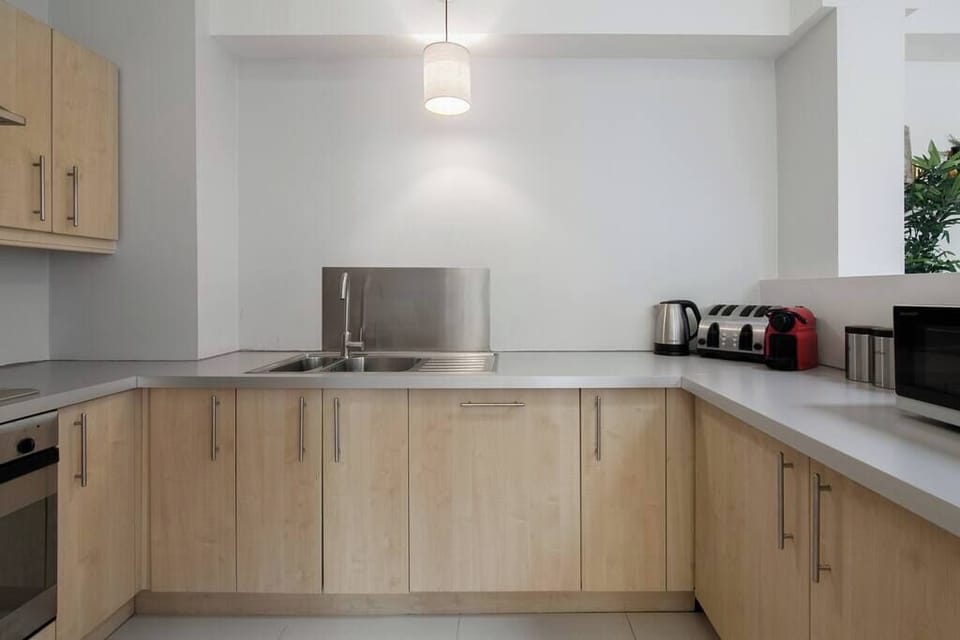 Well-equipped kitchen with everything you need including microwave, kettle, and complimentary teas and coffee