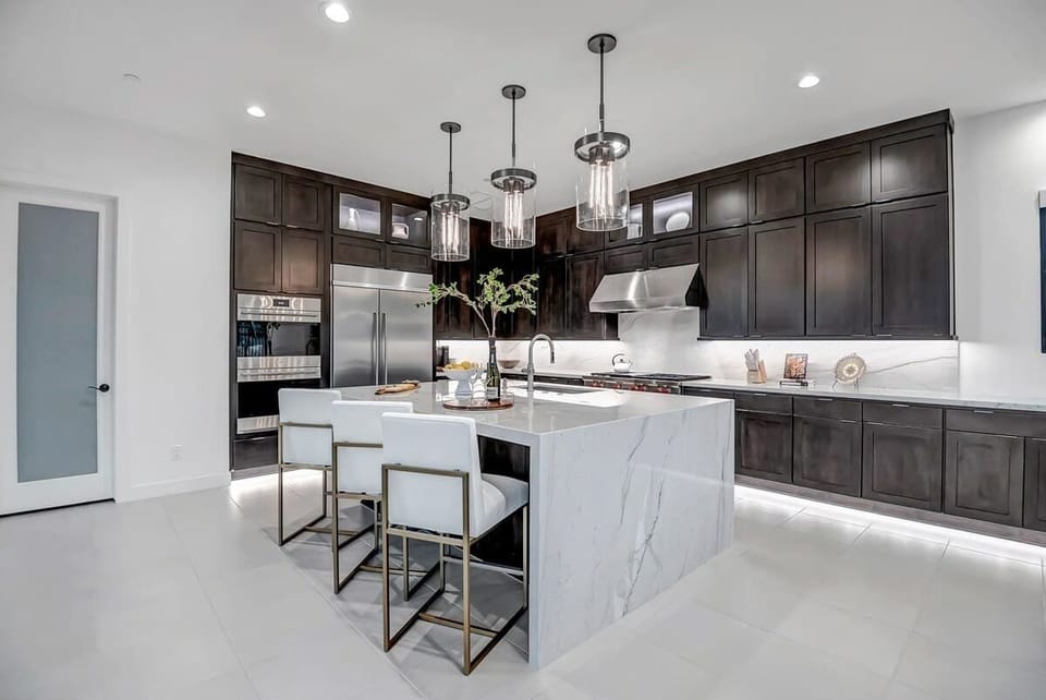 In this modern kitchen, where sleek design meets functionality, every meal becomes a culinary masterpiece waiting to happen. The perfect blend of style and comfort invites you to create, share, and savor unforgettable moments.