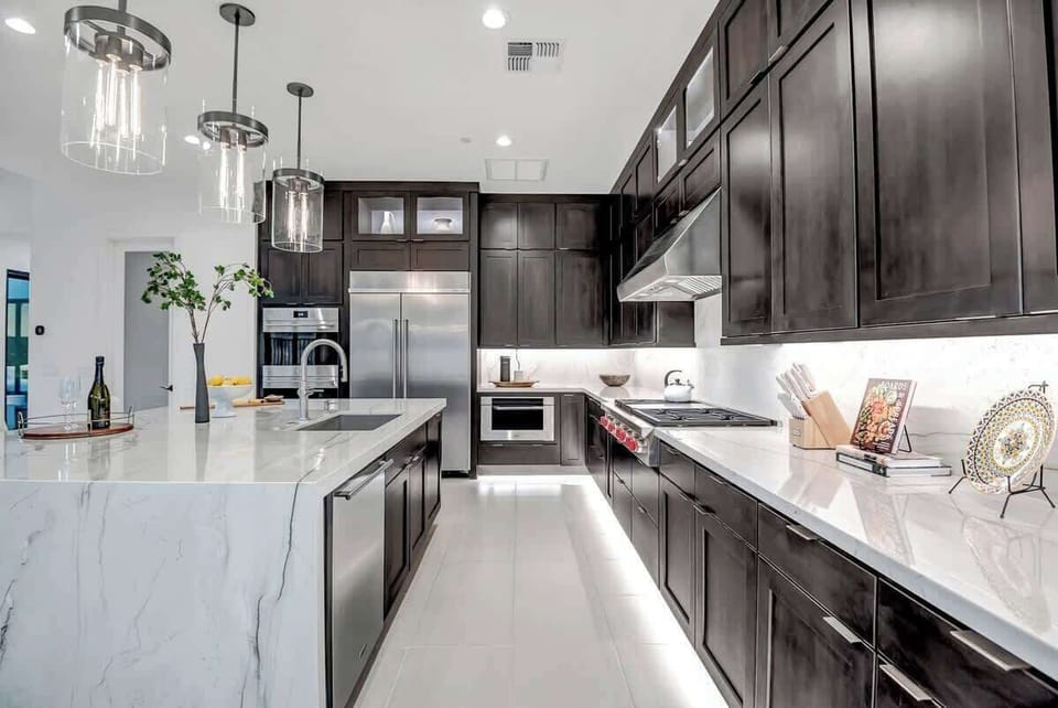 Elevate your culinary game in this sleek, modern kitchen where every detail is designed for both style and function. From the gleaming surfaces to the state-of-the-art appliances, this space is a chef’s dream come true. #KitchenGoals #ModernLiving #HomeInspiration