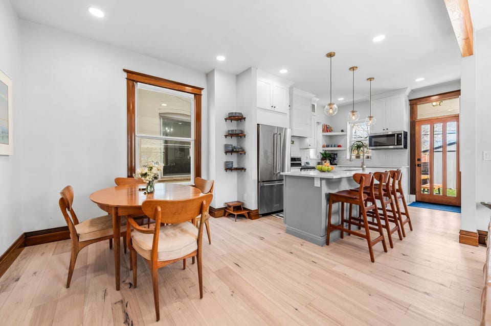 Dining and Kitchen Area - Seating for 4-8 at the dining table. There are 2 leaves and extra chairs to seat a total of 8 plus 3 at the breakfast bar.