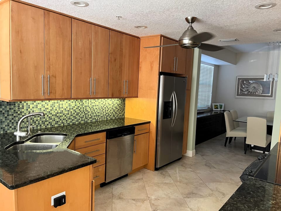 Kitchen area.  Stainless appliances, under cabinet lighting, granite countertops