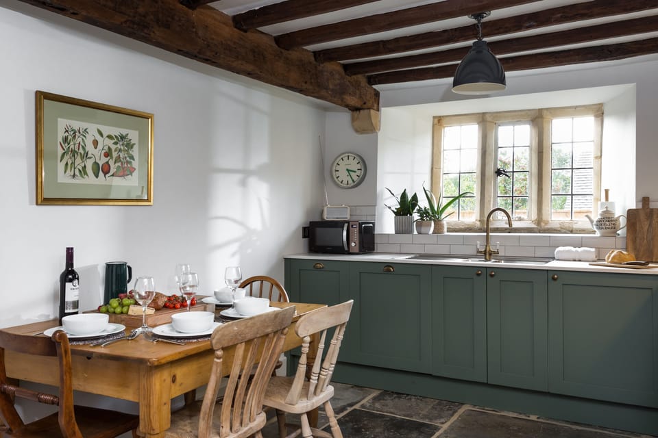 Beautiful beams and mullion window filling the kitchen with natural light