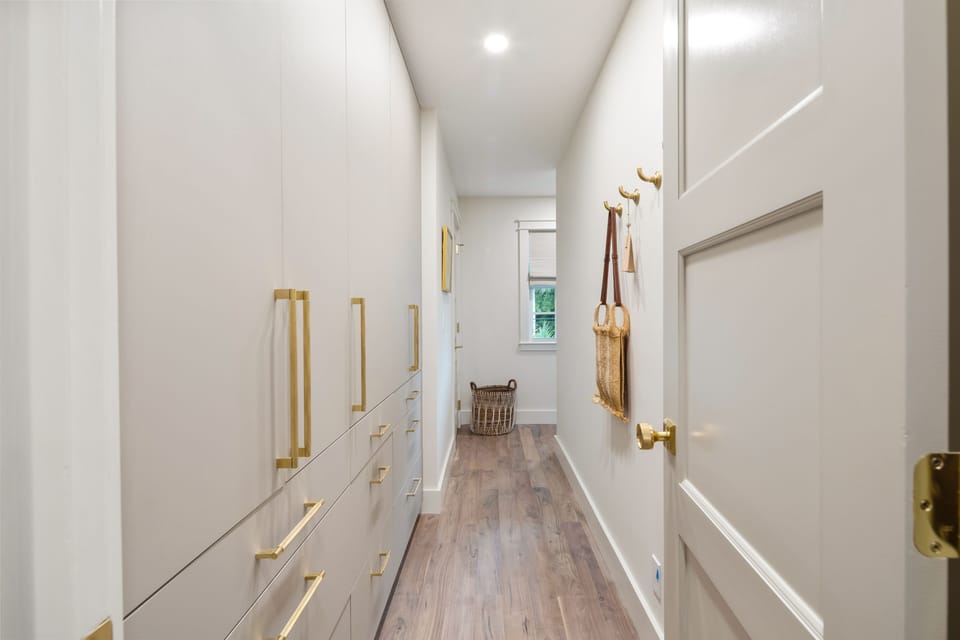 Look at this primary walk-in closet!