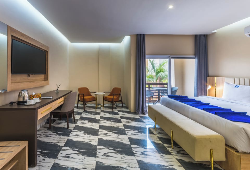 Superior Room, Balcony, Partial Ocean View | Minibar, desk, laptop workspace, soundproofing