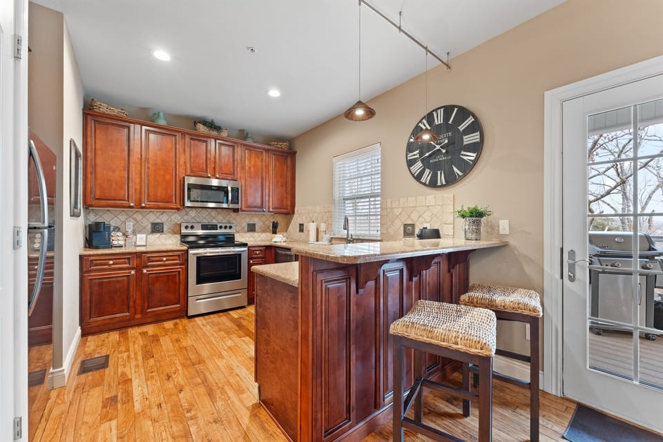Kitchen with bar Height breakfast area