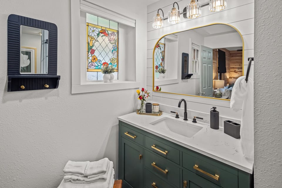 Get ready side by side in the cabin bathroom. Double sinks and a wide mirror leave room for both of you.