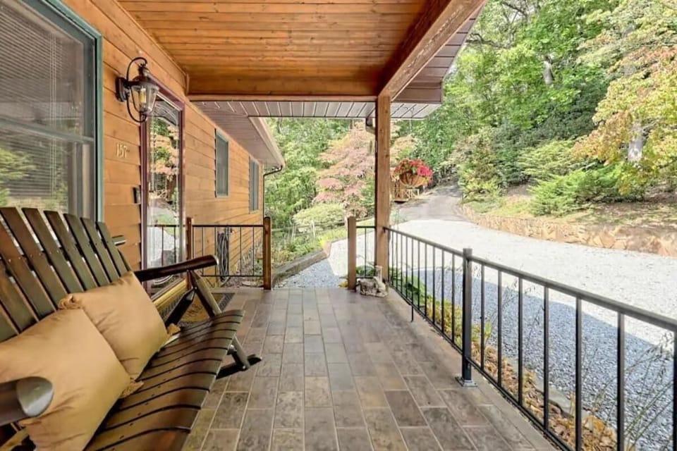 Front porch with a two-seat rocker for the lazy afternoons!