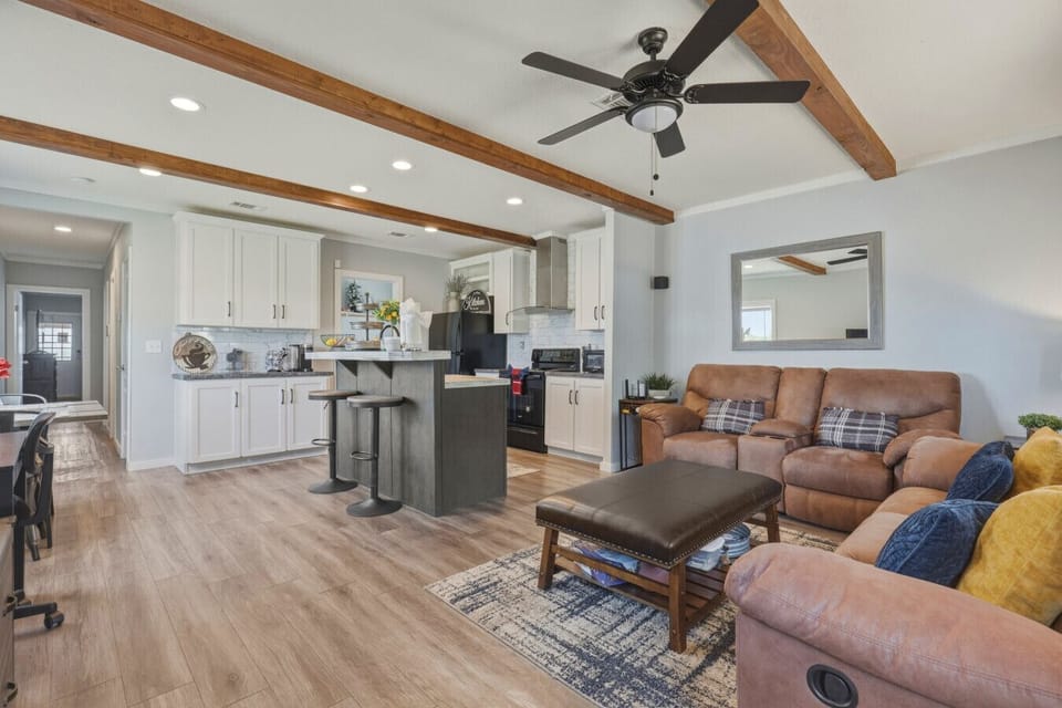 Open living area with kitchen and seating space