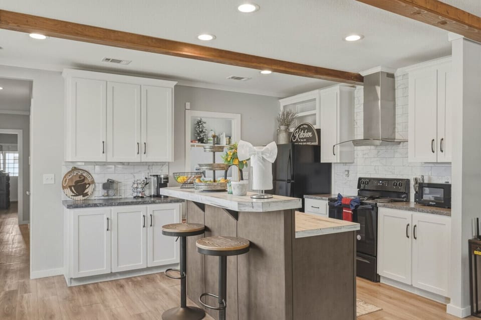 Kitchen with island and bar seating