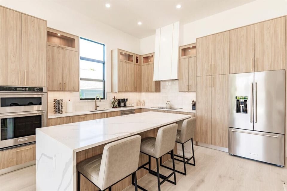 High Ceilings Gourmet Kitchen with Barstool Seating.