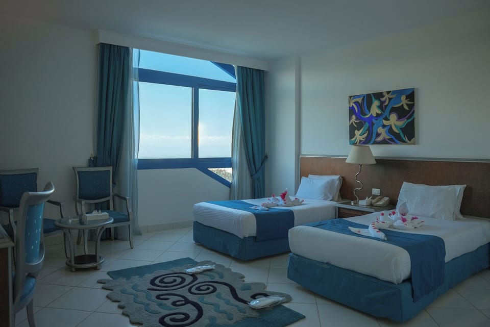 In-room safe, individually furnished, iron/ironing board, bed sheets