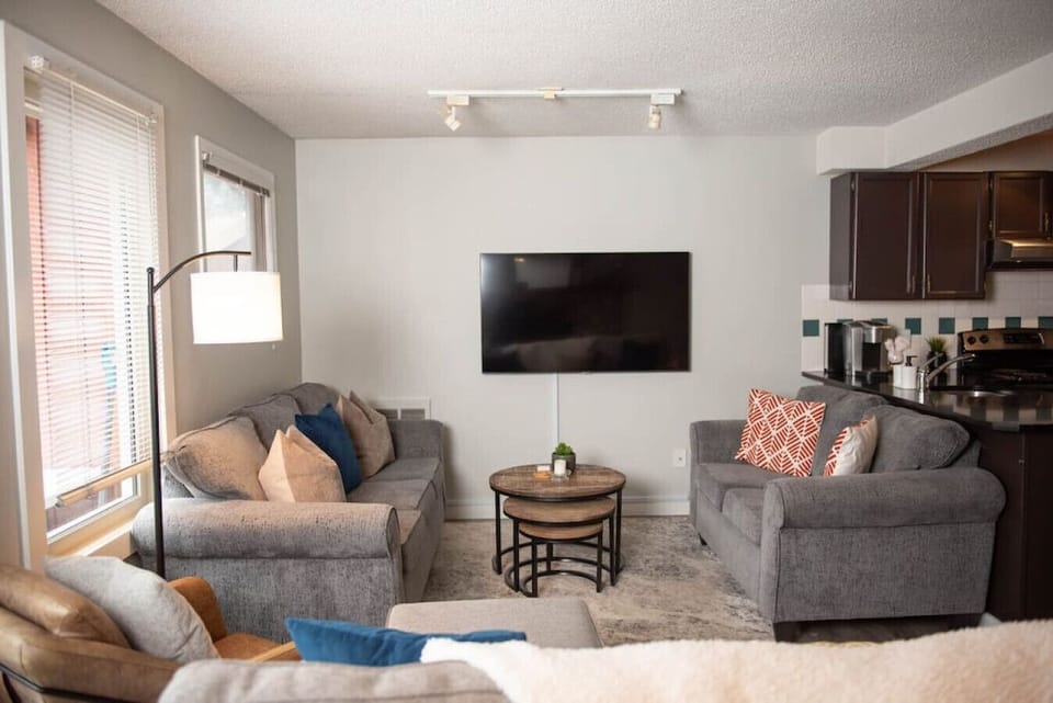The living room has a TV perfect for watching a movie with the whole family.