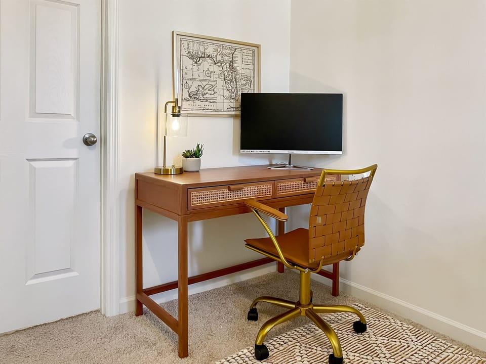 [Primary Suite] Dedicated desk with monitor and HDMI cable for remote work days
