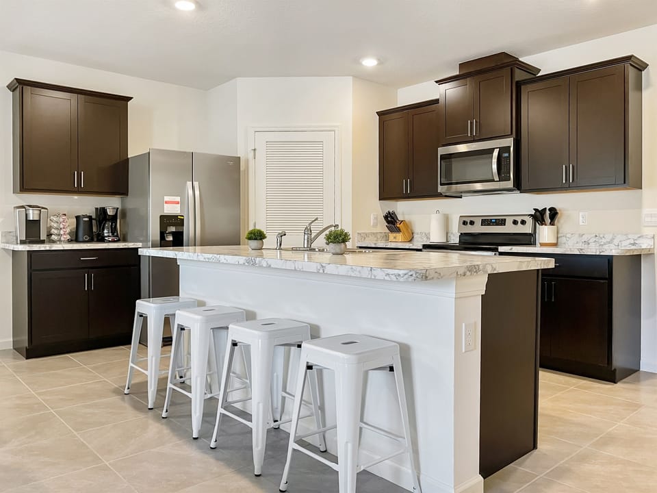 [Kitchen] Full kitchen with island seating, dishwasher, and everything to cook for 9