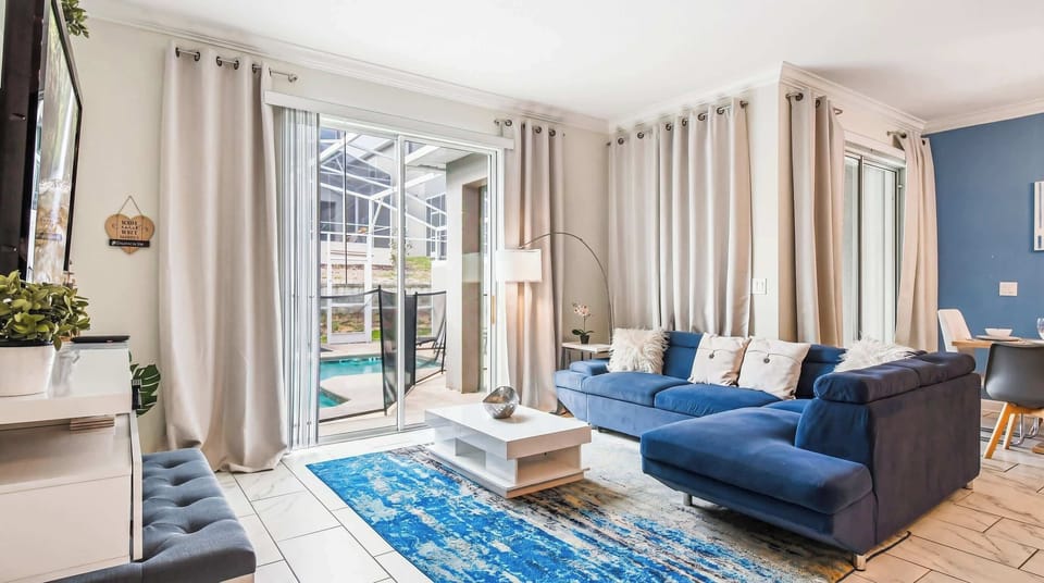 Generous living space, featuring a comfortable sofa, ideal for a family reunion and shared moments.