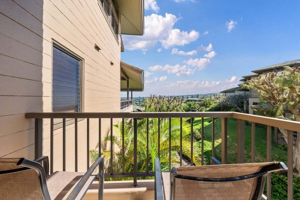 Private bedroom lanai with seating and garden views, perfect for enjoying fresh air and quiet moments outdoors.