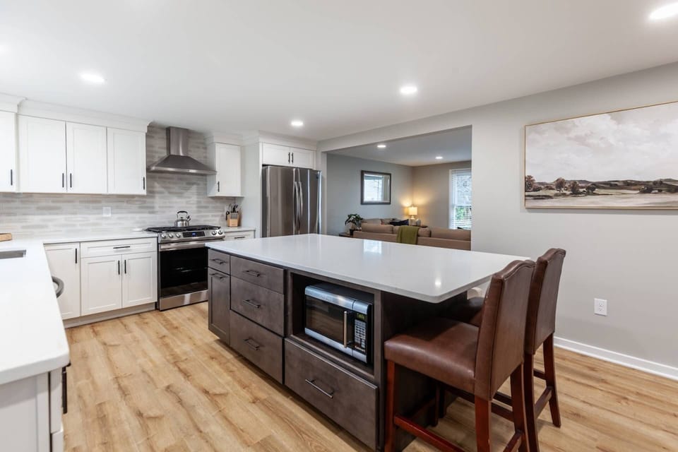 The spacious kitchen island has plenty of room to prep a meal and has a built-in microwave.