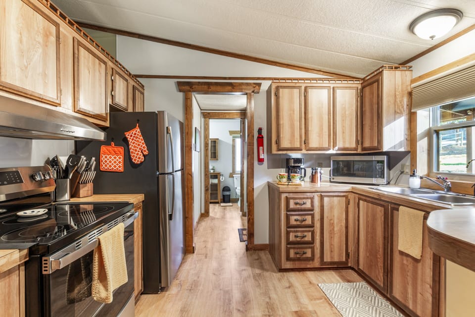 Enjoy the convenience of a brand new full-size refrigerator, range, and microwave. Whether you're preparing a quick breakfast before heading out or cooking a relaxed dinner in, you'll have everything you need right at your fingertips