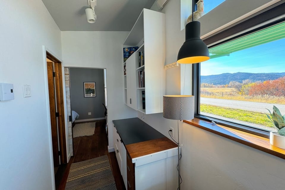 The west-facing windows offer stunning views of the Big Hole Mountains.