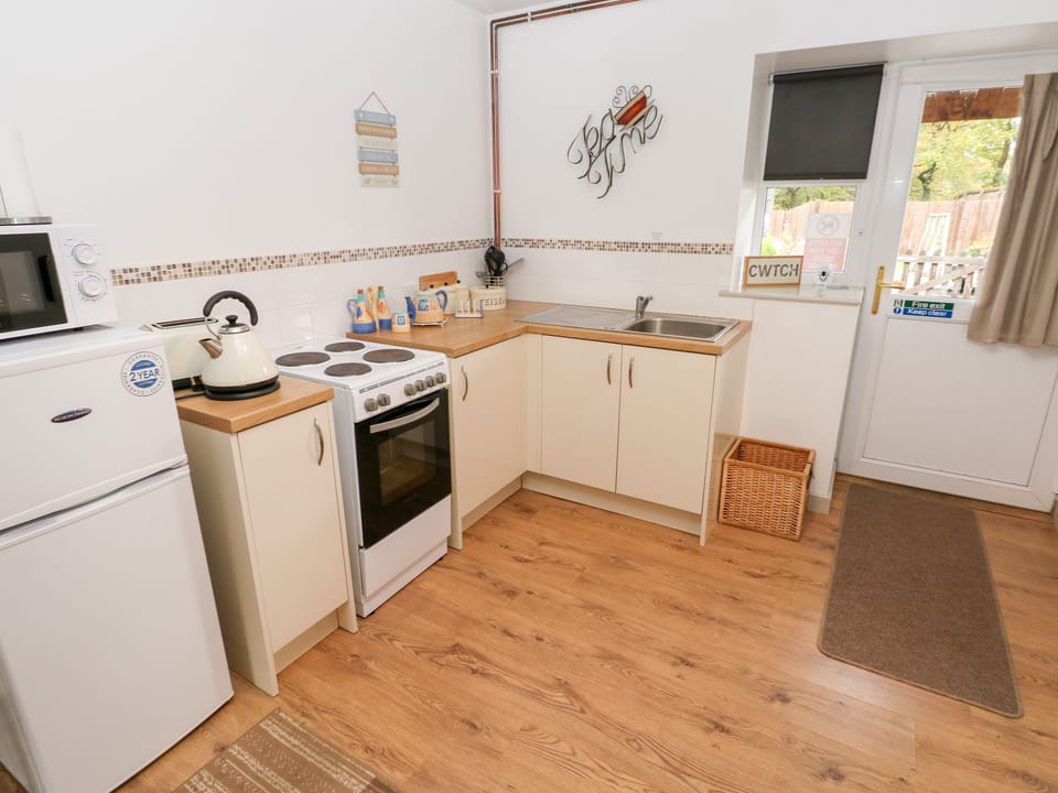 Fridge, electric kettle, toaster, cookware/dishes/utensils