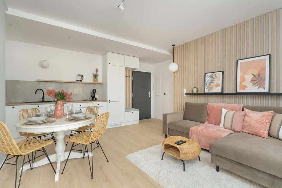 A harmonious layout featuring a spacious living room connected to the dining area, with a neutral color palette and soft lighting.


