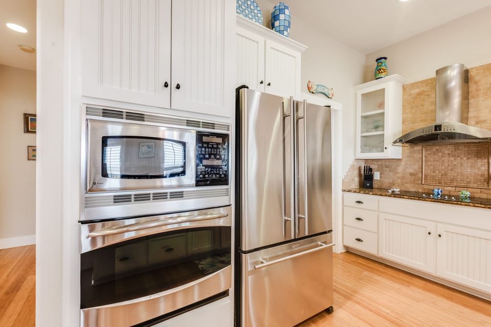 Your fully equipped kitchen features stainless steel appliances and granite countertops, perfect for preparing meals during your stay.