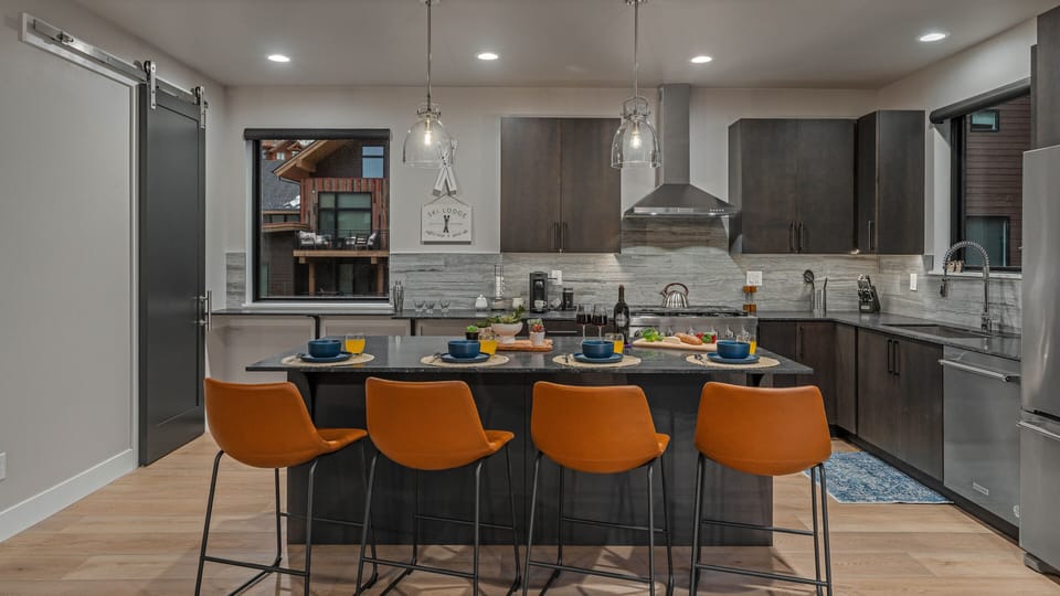 Kitchen, Main Level - With breakfast bar seating