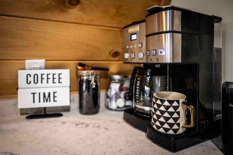 Loaded coffee bar with premium coffee K cups and beans.