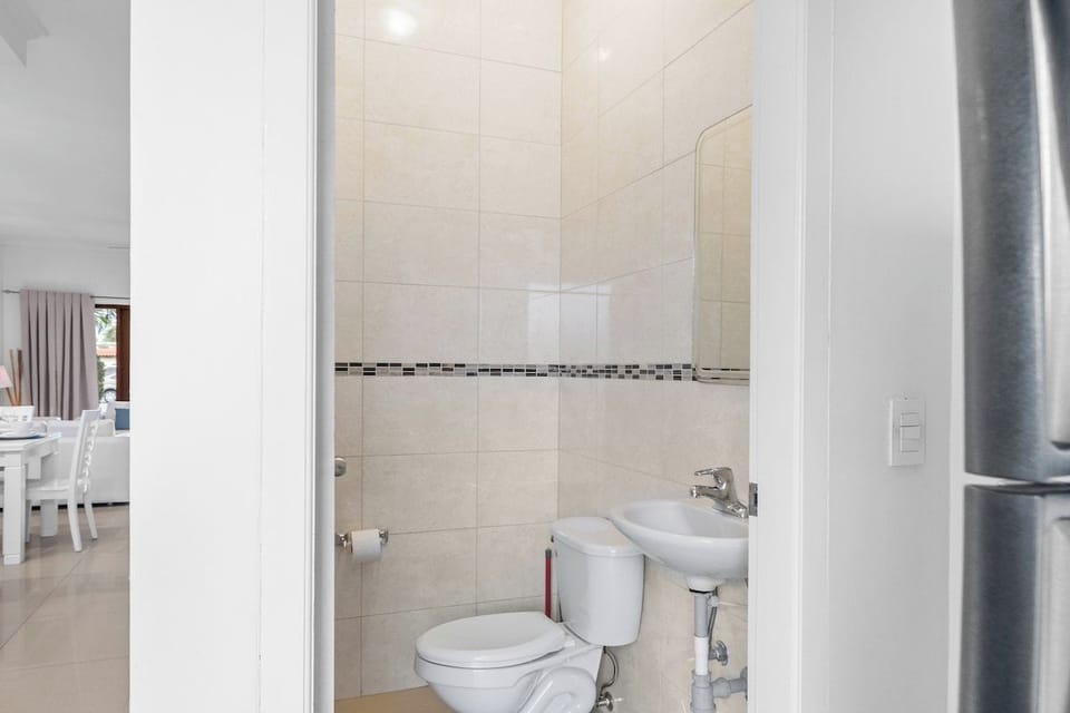 A powder room of the 2BR Condo in Noord Aruba - For a quick toilet break - Neat and clean