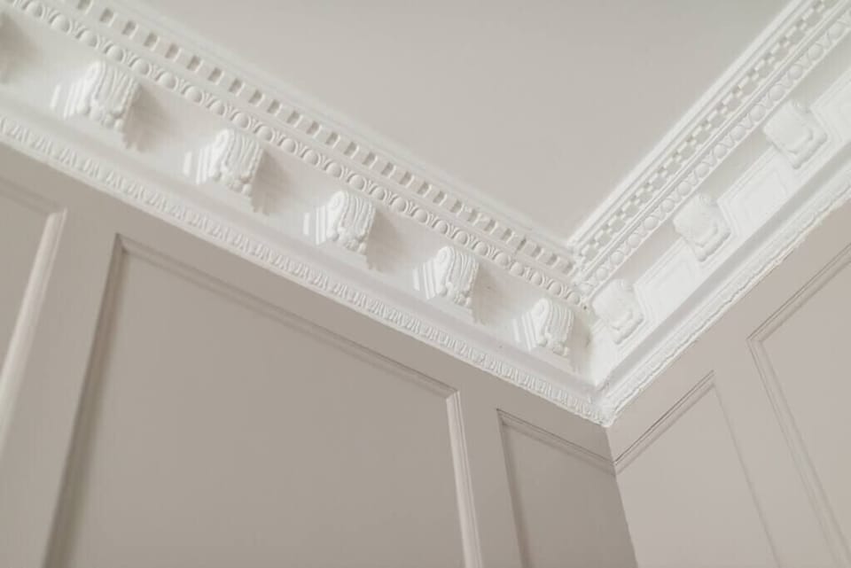 Marvel at the Elegant cornice's brushed of the Georgian paneling