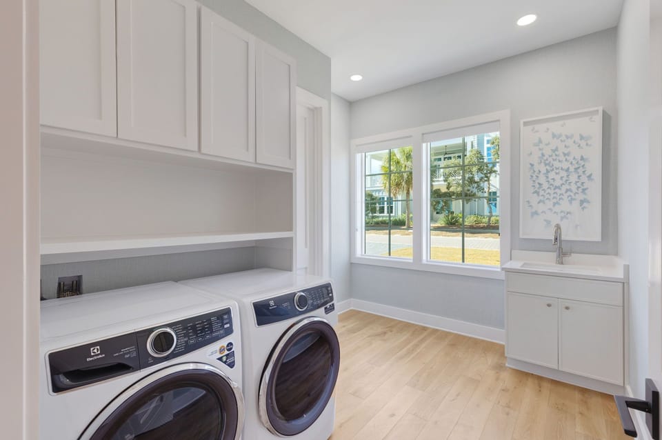 Washer and dryer on ground level in mud room