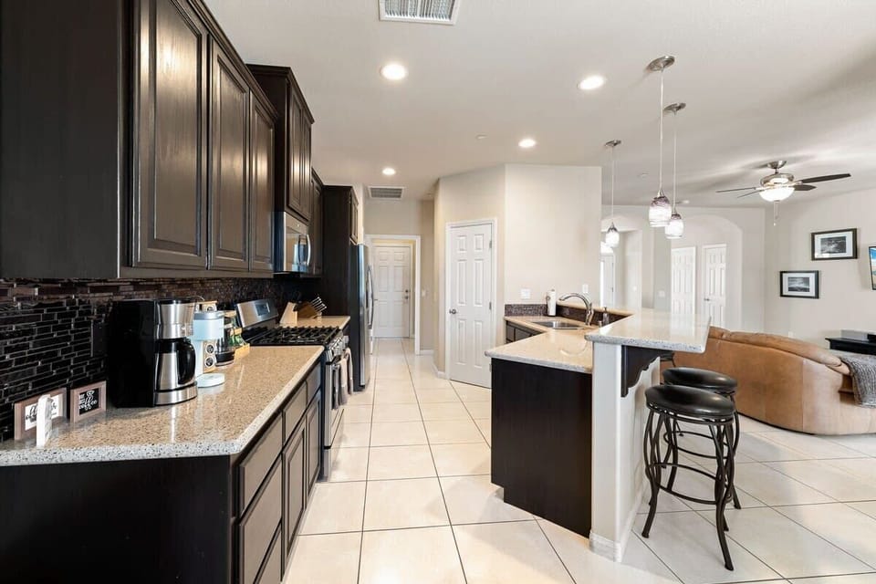Kitchen with barstools along the counter for casual dining
