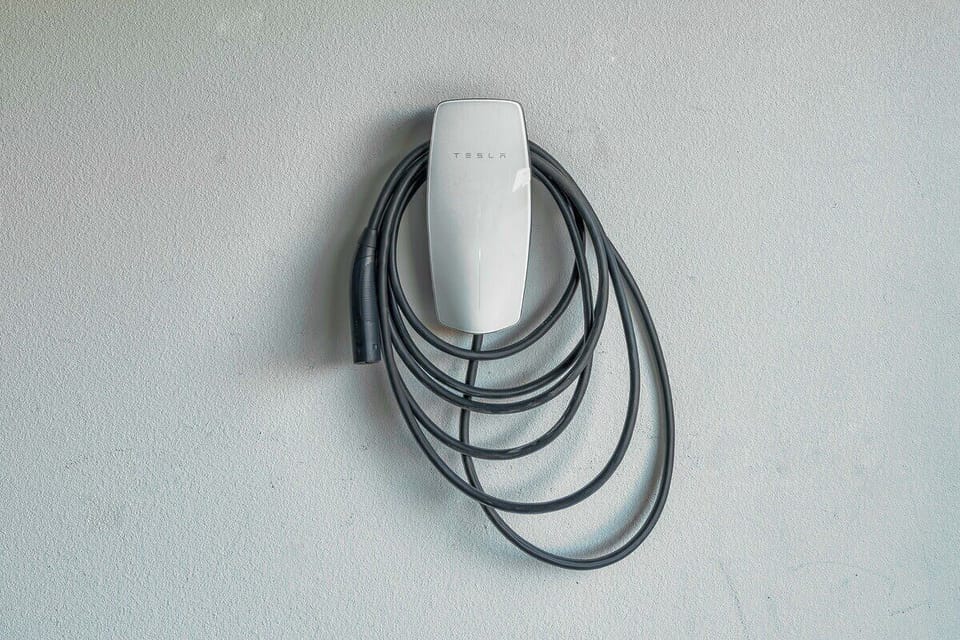 Tesla charger located in the garage.  Other EVs can also charge with a Tesla to J1772 adapter.  Please inquire if you need help with the adapter.