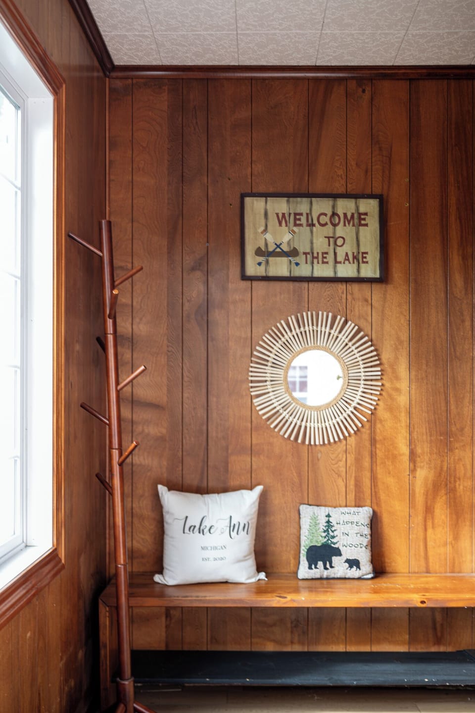 Welcoming entryway w/ warm wood accents & charming decor details.