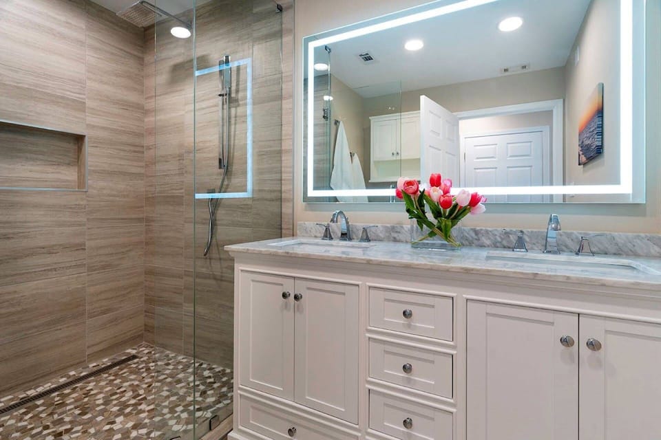 Master Bathroom - Clean, Inviting & Relaxing ~ Double Vanity, Glass Encased Shower, and Commode