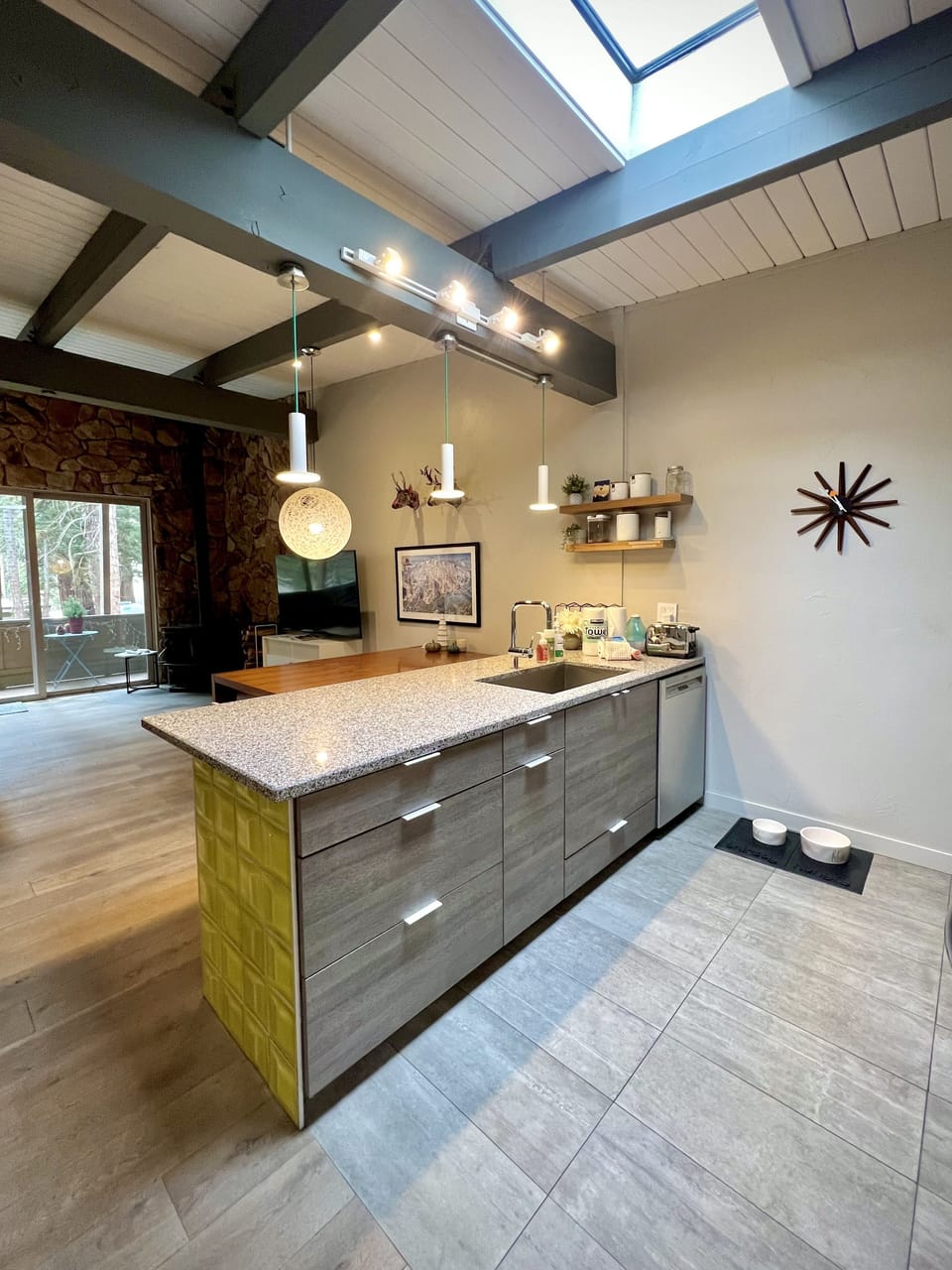 Fully remodeled kitchen with new cabinets, under-mount sink and large granite peninsula.