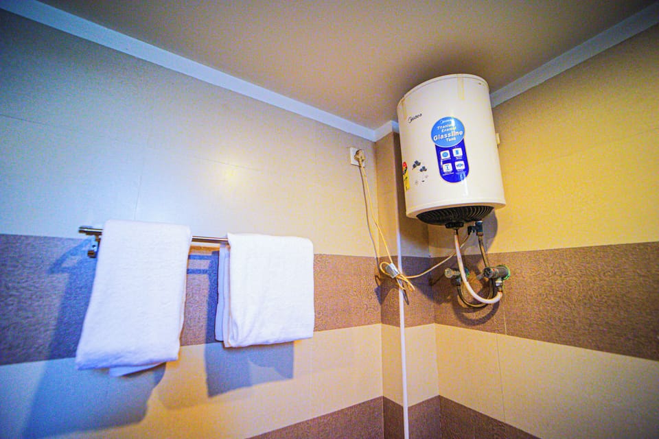 Shower, rainfall showerhead, towels, soap