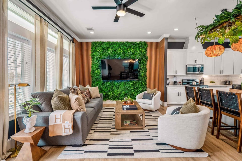 Different view of the living room; again, showcasing all the custom Green Haus jungle design and enticing theme that's carried throughout the home.