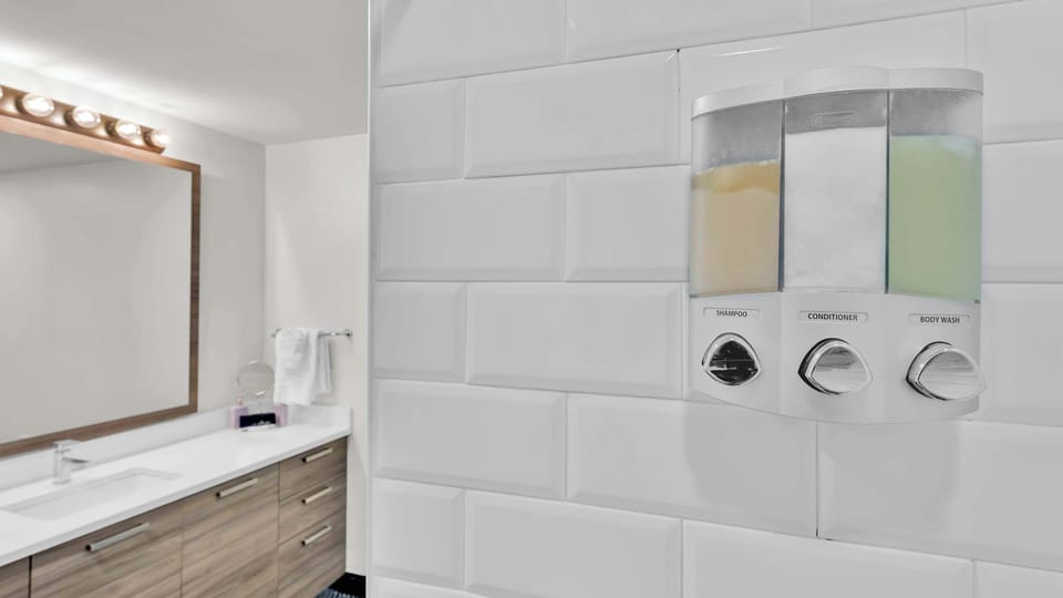 Our modern bathroom comes stocked with fluffy towels and premium toiletries to help you unwind.