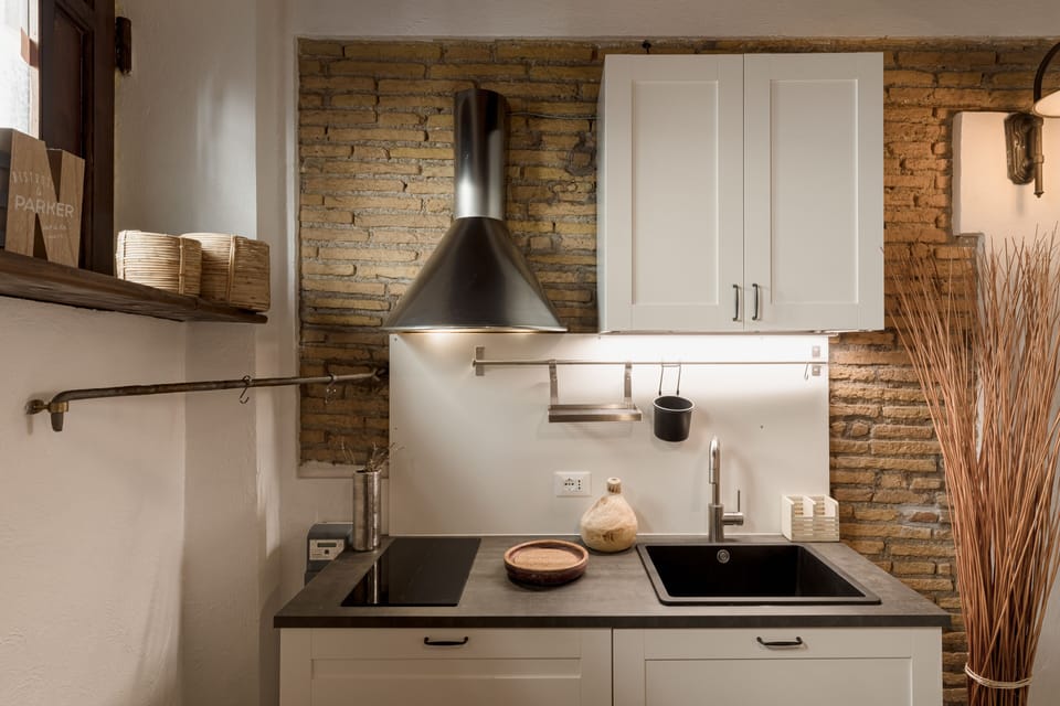 Full-size fridge, stovetop, espresso maker, coffee/tea maker