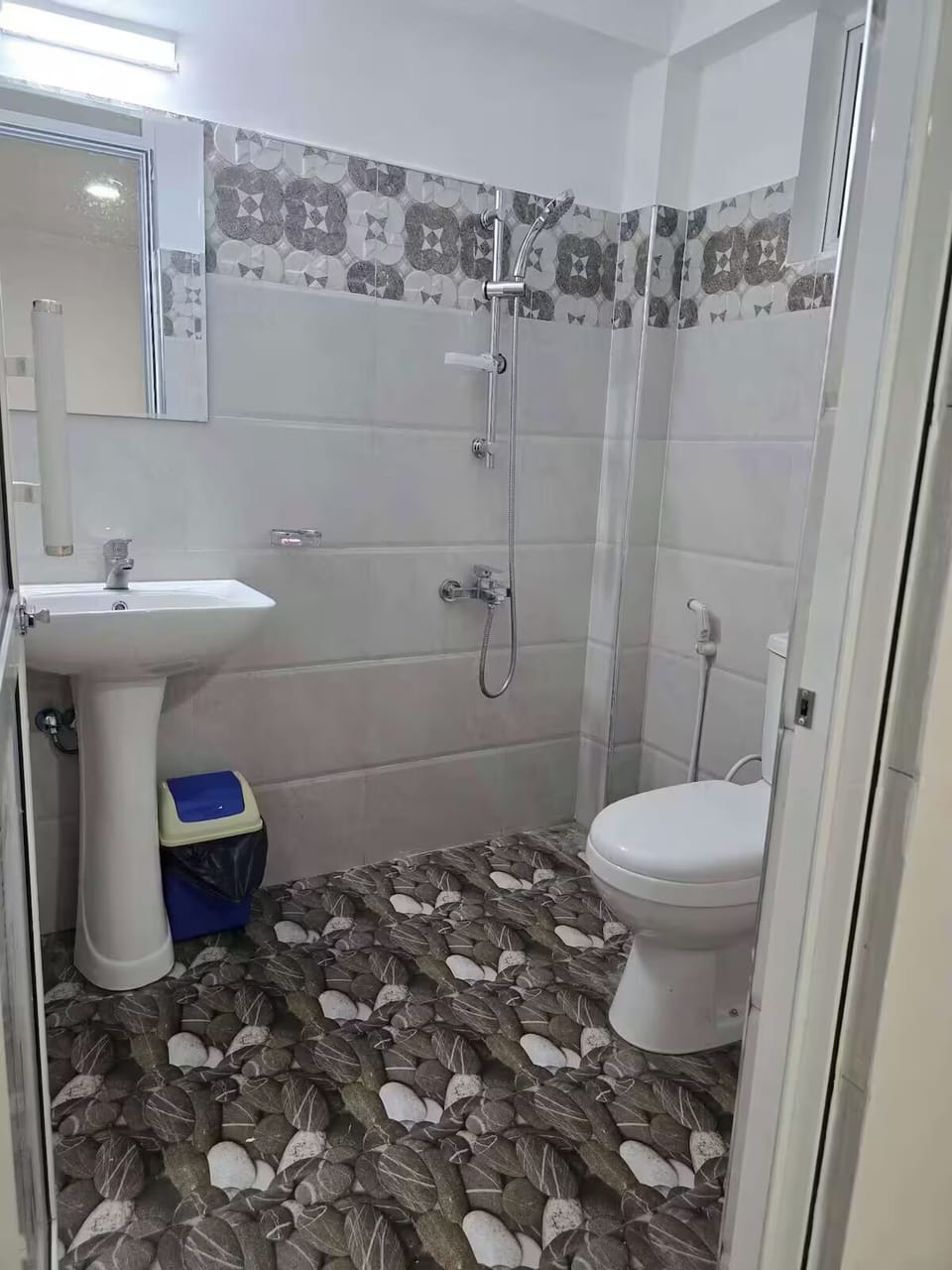 Shower, rainfall showerhead, towels, soap