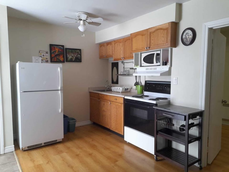 Family Room | Private kitchen | Coffee/tea maker, full-size fridge, microwave, electric kettle