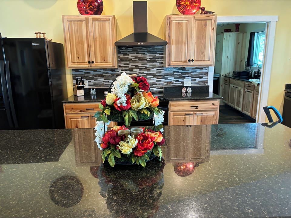 Granite island with decorative centerpiece. 