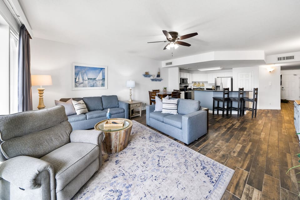 Unwind in your bright, open living space with coastal charm, comfortable seating, and nautical touches.