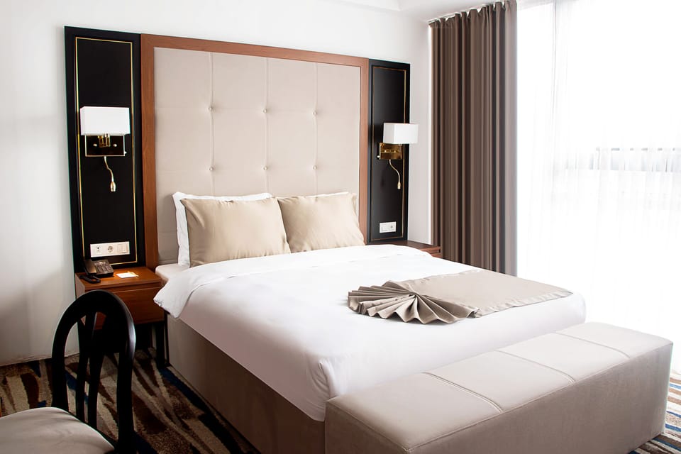 Family Double or Twin Room | Minibar, in-room safe, desk, laptop workspace