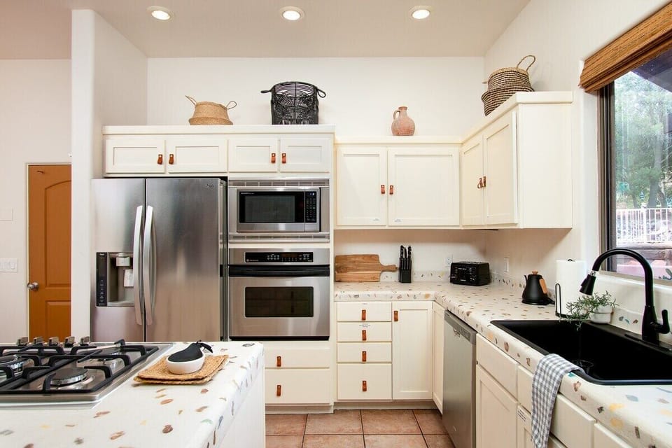 Chef's kitchen with modern appliances and all of the tools you might need