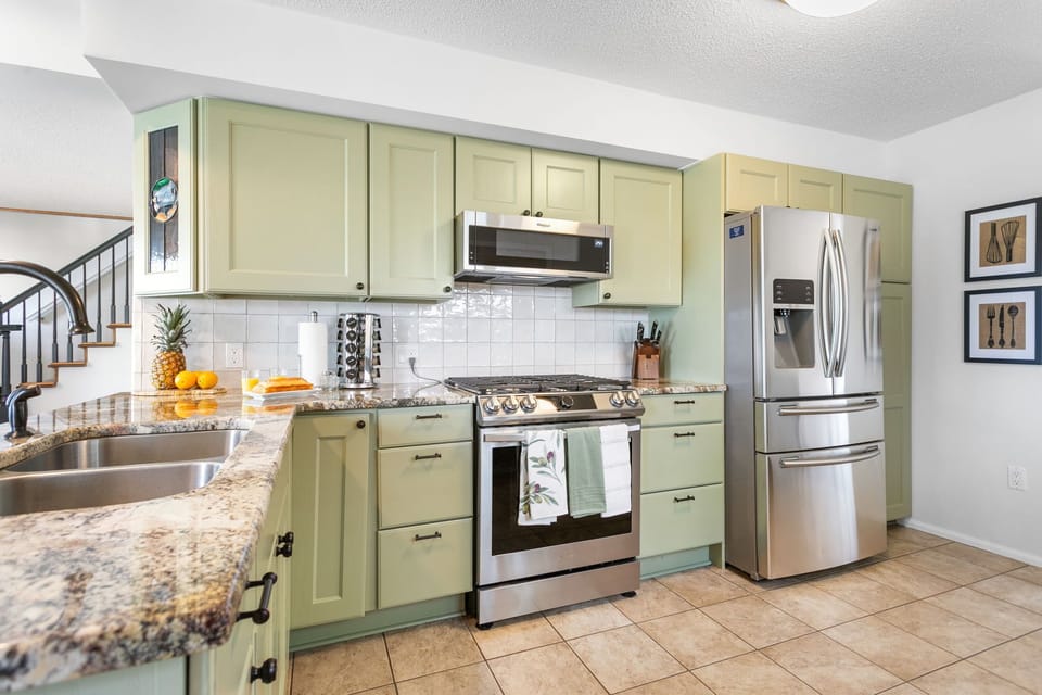 Gas range and refrigerator with filtered water and ice