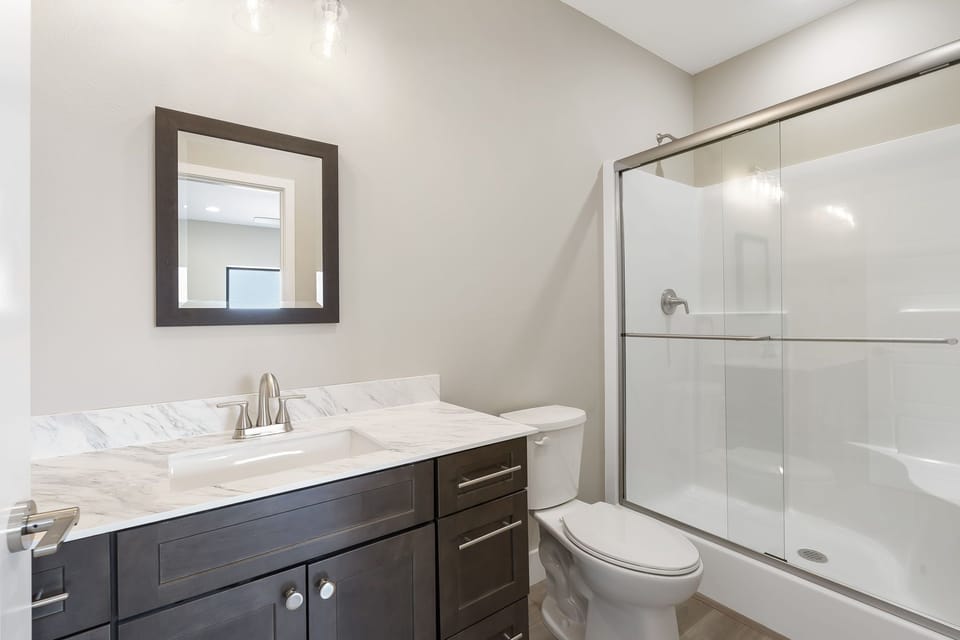 Main level master bedroom with en suite shower